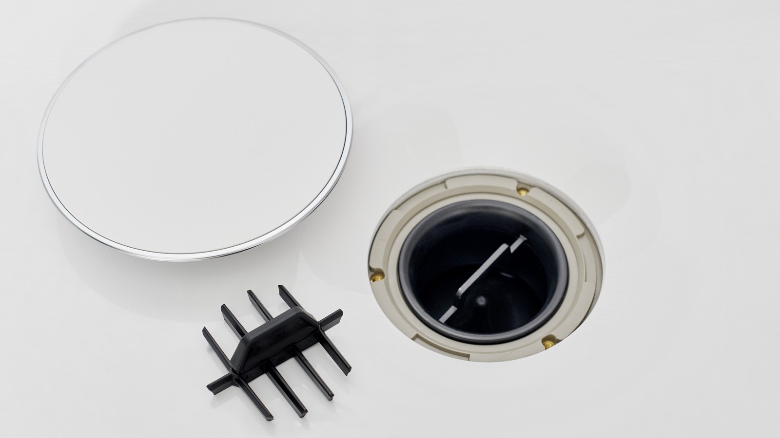 Sifono dangtelis ir dantytasis nuosėdų šalinimo įdėklas Sifono dangtelis ir dantytasis nuosėdų šalinimo įdėklas