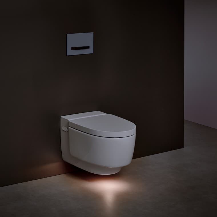 Geberit AquaClean Mera WC puodas su apiplovimo funkcija ir su įjungtu orientaciniu apšvietimu Geberit AquaClean Mera WC puodas su apiplovimo funkcija ir su įjungtu orientaciniu apšvietimu